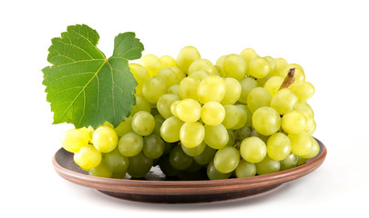 grapes in a plate on a white background