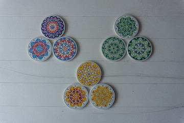 Colorful disks neatly arranged on a white table