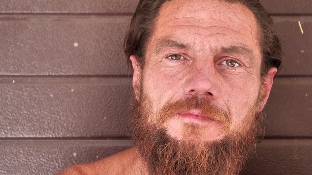 Real down-and-out person with no fixed abode, homeless man close-up