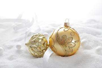 golden christmas ornaments on white background