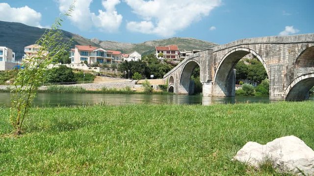 Old beautiful bridge over Trebisnjica river in Trebinje city, Republika Srpska, Bosnia and Herzegovina