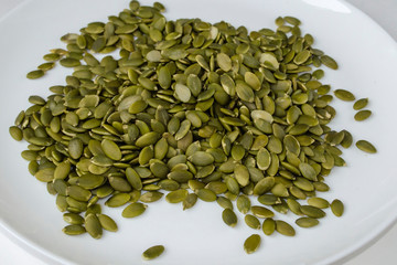 Pumpkin seeds on a white background