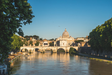 Vatican dome of Saint Peter Basilica (Italian: San Pietro) and Sant'Angelo Bridge, over Tiber river, Rome, Italy, Europe