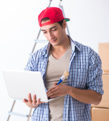 Young painter contractor choosing colors for home renovation