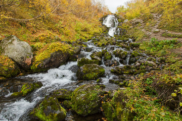 River in mountains. Beautiful autumn landscape in Kamchatka near Vachkazhetz volcano