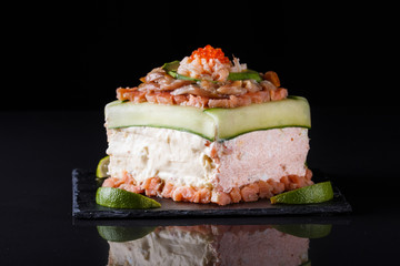 Piece of traditional savory swedish sandwich cake Smorgastorta