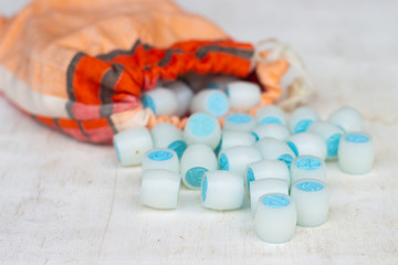 Board game lotto. Blue lotto barrels with bag, game cards and red chips for a game in lotto. Top view