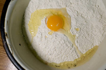 Knead the dough in an old bowl