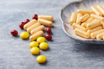 Beta-Carotene, Vitamin C tablets and Coenzyme Q10 capsules. Antioxidants. Concept for a healthy...