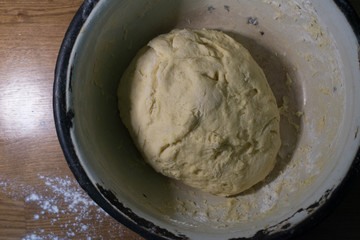 Knead the dough in an old bowl