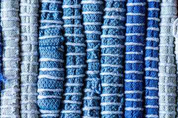 Extreme close up showing detail of a rag rug in blue and white.