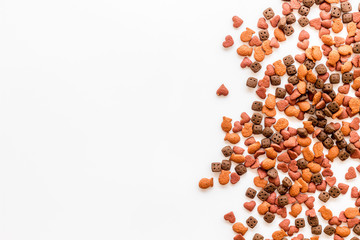 Kitten dry food on white background top view space for text