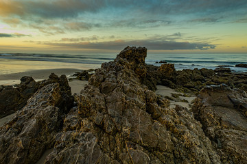 Fototapeta na wymiar Good morning!! Crystal Cove State Park. Lovely morning walk with gorgeous light, clouds, stones formation, and ocean view.