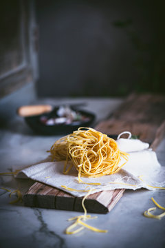 From above appetizing dry pasta on tablecloth on table