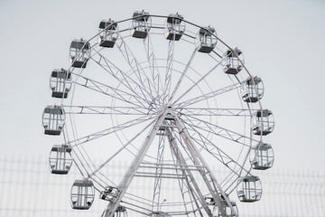 Ferris wheel against the background of the summer sky