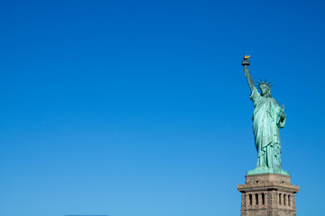 Fototapeta na wymiar Statue of Liberty with clear sky and copy space II