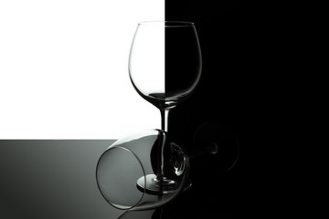 Empty wine glasses for wine isolated on black and white background. Wine list design menu with copy space. Alcohol beverage card backdrop.