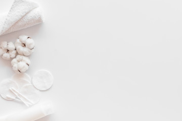 Hygiene cotton swabs, pads and cream for pattern on white background top view mock up