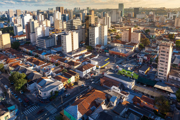 Aerial view of streets and avenues in Pinheiros neighborhood with commercial buildings and small...