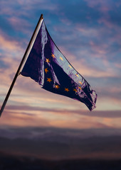 European Union flag, EU flag waving on sky at dusk	