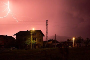 lightning storm over the village in the night