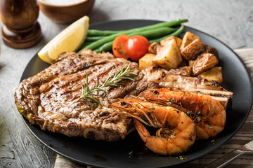 surf and turf, ribeye steak and grilled prawn