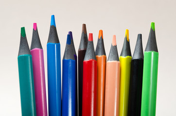 Drawing pencils. Colour pencils isolated on gray background close up.