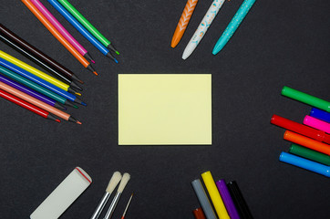 Note paper. Colorful notebooks and office supplies.