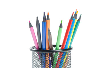 Color pencils in pencil tray isolated on white background.