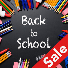 Large set of new School Supplies on Chalkboard with back to school message and sale tag