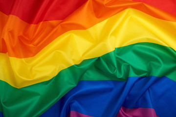 textile rainbow flag with waves, LGBT culture