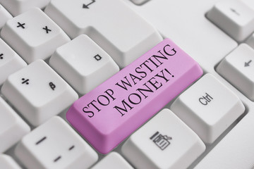 Conceptual hand writing showing Stop Wasting Money. Concept meaning advicing demonstrating or group to start saving and use it wisely White pc keyboard with note paper above the white background
