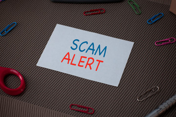 Handwriting text writing Scam Alert. Conceptual photo unsolicited email that claims the prospect of...