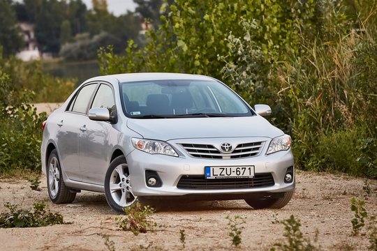 BAJNA, HUNGARY - OCTOBER 28, 2016: Toyota Corolla 2011 model E15 facelift in a field. Corollas are one of the best selling cars in the world