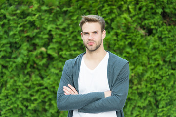 Naklejka na ściany i meble Bearded guy casual style. Simplicity, good taste and grooming. Man knows what real beauty is. Handsome man unshaven face and stylish blond hair. Handsome caucasian man nature green background