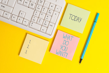 Text sign showing What Do You Want Question. Business photo showcasing say or write in order to ask demonstrating about something Empty papers with copy space on the yellow background table
