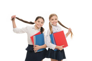 Private school. Girls with school textbooks white background. We love study. Studying is fun. Buy book for extra school course. Pupils carrying textbooks to school classes. Language courses for youth