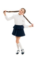 Smiling schoolgirl. Celebrate knowledge day. September time to study. Girl cute pupil on white background. School uniform. Back to school. Student little kid adores school. Pupil of first grade