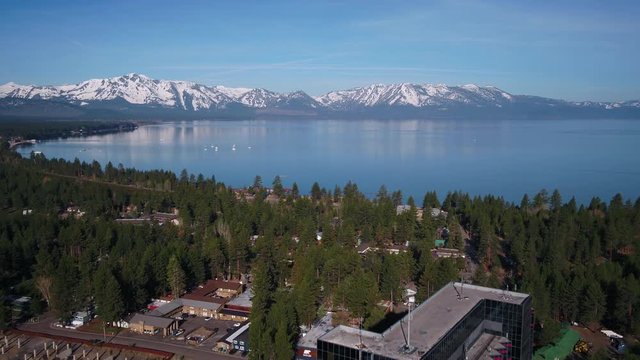 Aerial Nevada South Lake Tahoe Border May 2019 Sunny Day 30mm 4K Inspire 2  Aerial video of casinos and Lake Tahoe on a beautiful sunny day.