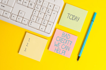 Text sign showing Bad Credit Question We Can Help. Business photo showcasing offering help after going for loan then rejected Empty papers with copy space on the yellow background table