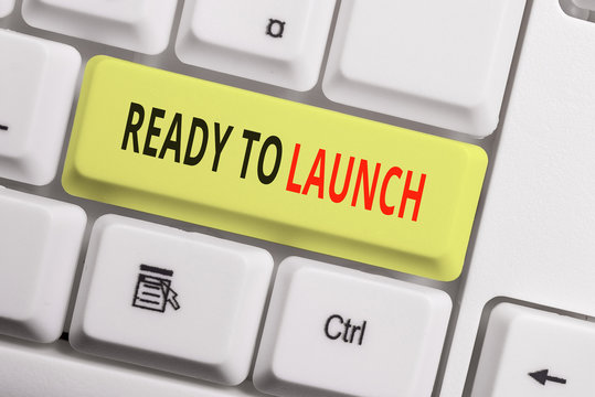 Text sign showing Ready To Launch. Business photo showcasing an event to celebrate or introduce something new to market White pc keyboard with empty note paper above white background key copy space