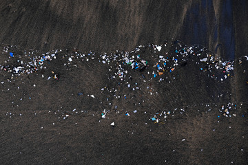 Microplastics pollution on an ocean beach.