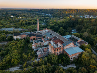 Ruined overgrown abandoned sugar factory in Ramon, aerial view