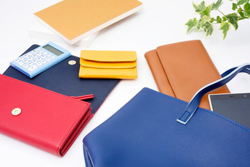 Wallet, bag, smartphone, book and calculator on white background 財布　バッグ　スマートフォン　本　電卓