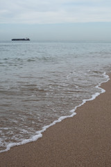 Waves Rolling into Shore during Blue Hour with Boats in the Ocean in Fort Lauderdale