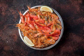 boiled shrimp on ice on dark concrete rustic table