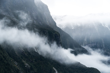 low Cloud hanging over the mountains in Milford Sound