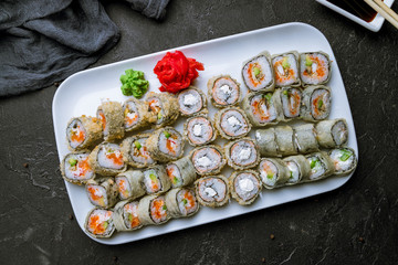 set of tempura rolls on black concrete table