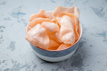 Fototapeta premium Vietnamese shrimp chips on grey concrete table