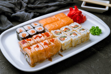 set of japan rolls on black concrete table